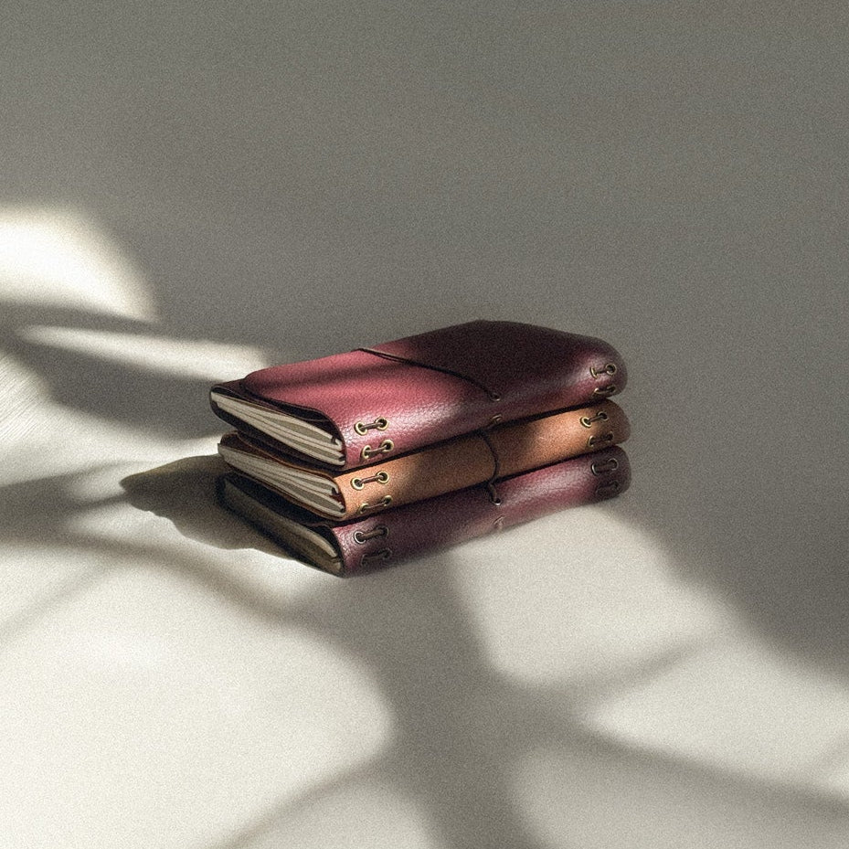 Two leather journals stacked 
